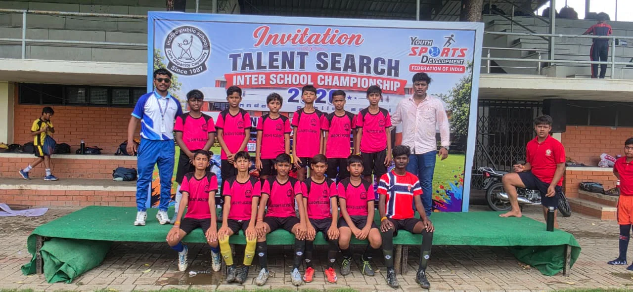 School football team with coaches and officials